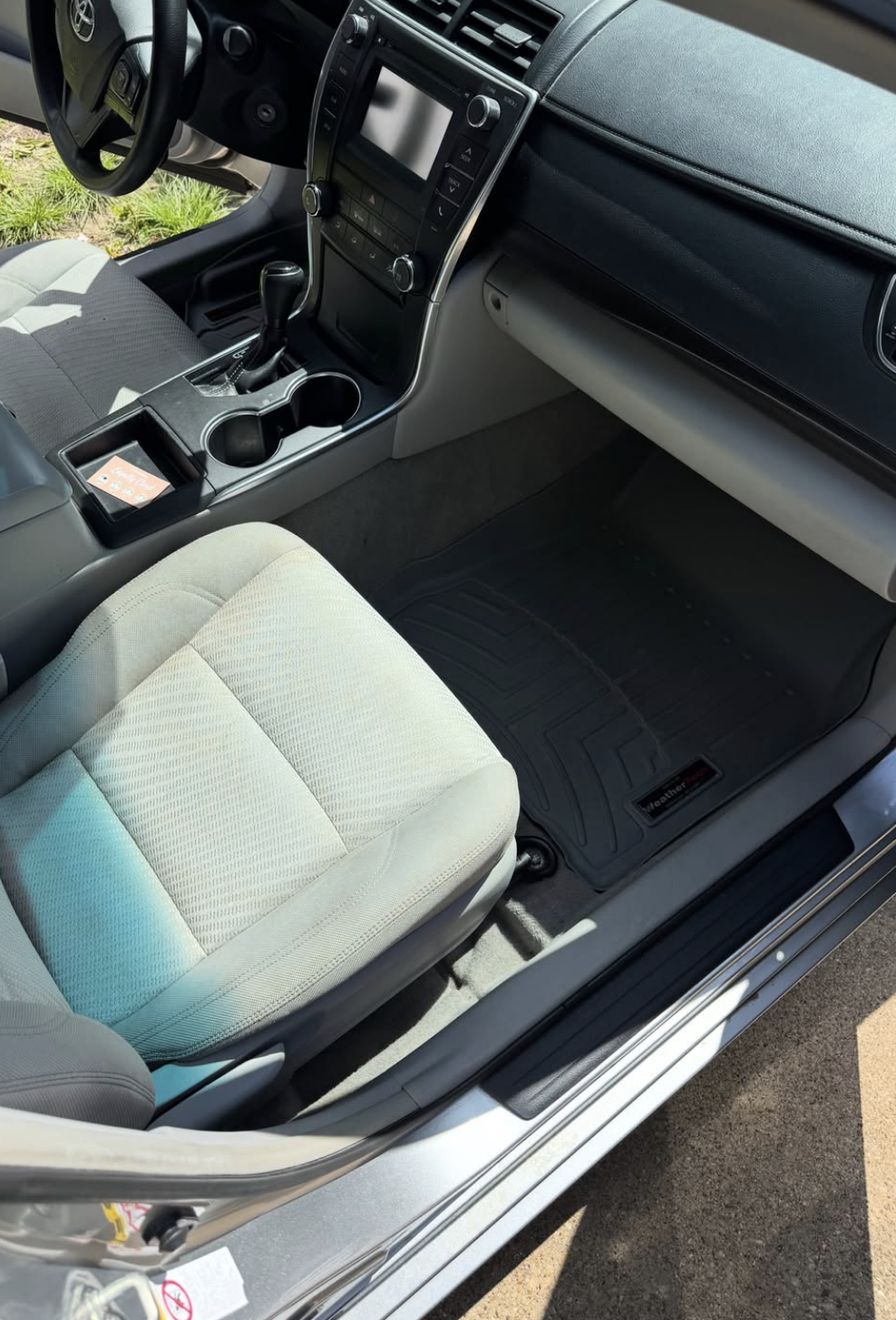 Fully extracted and stain-free sedan cloth seat with clean floor mats and polished console