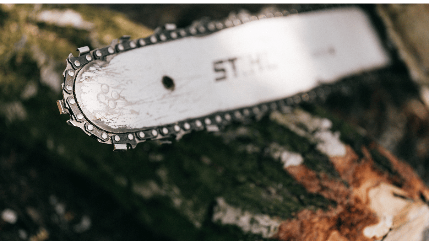 Stump grinding service in Arvada CO — machine grinding a tree stump below ground level