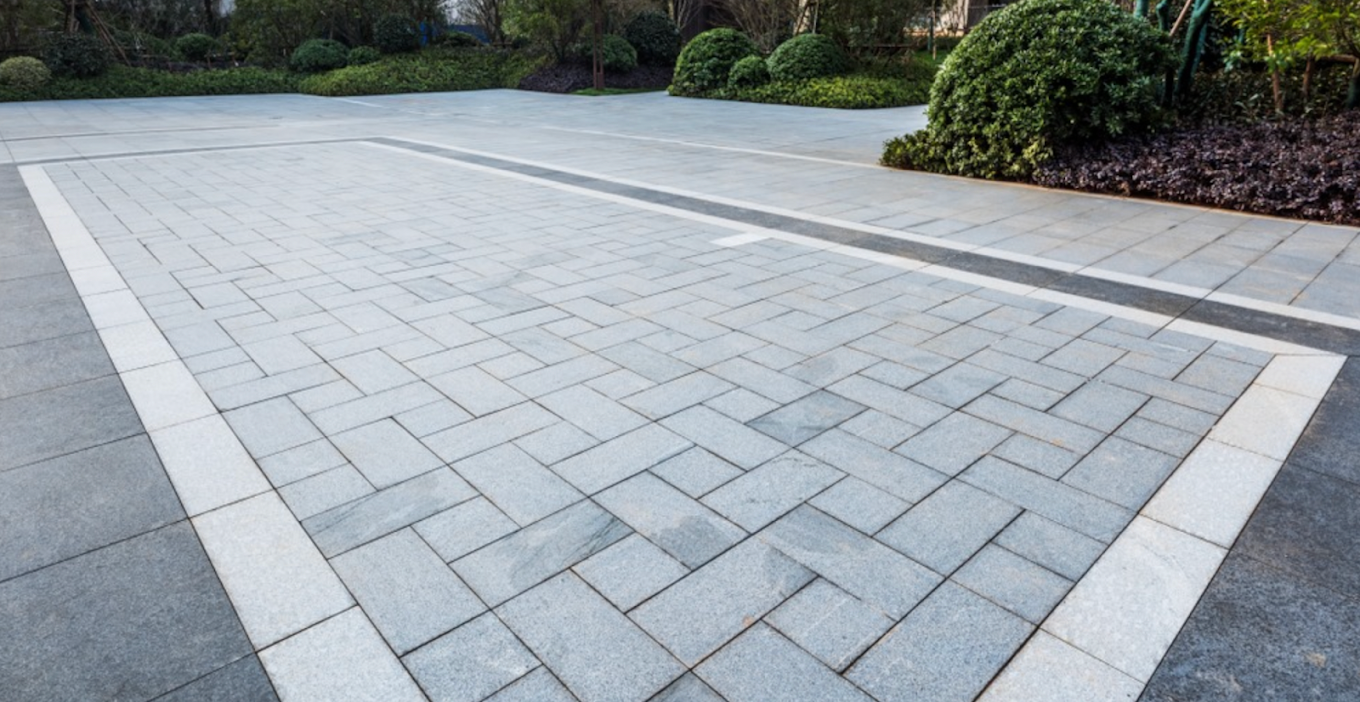 Herringbone pattern paver driveway with light border inlay