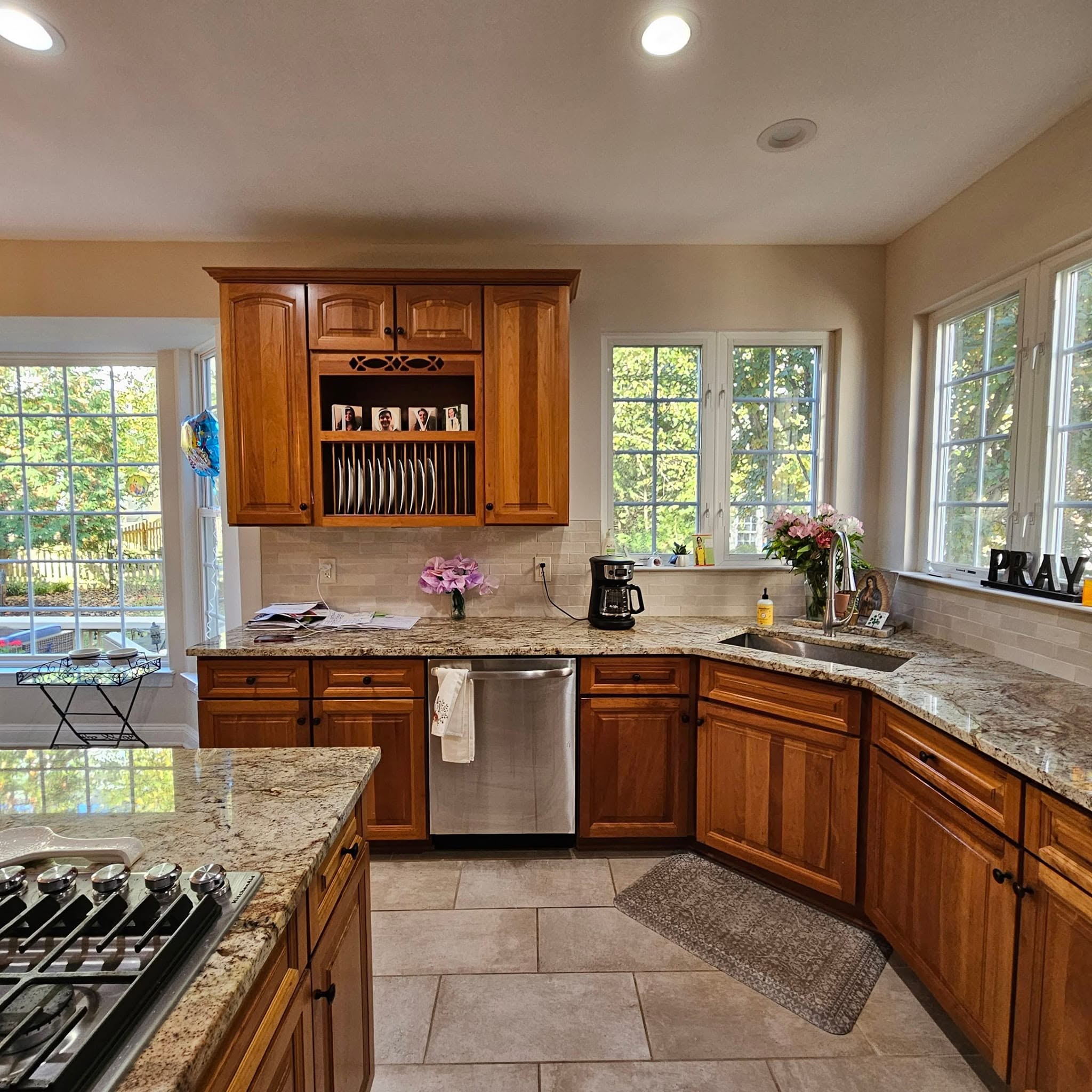 Oak cabinetry with plate rack — before
