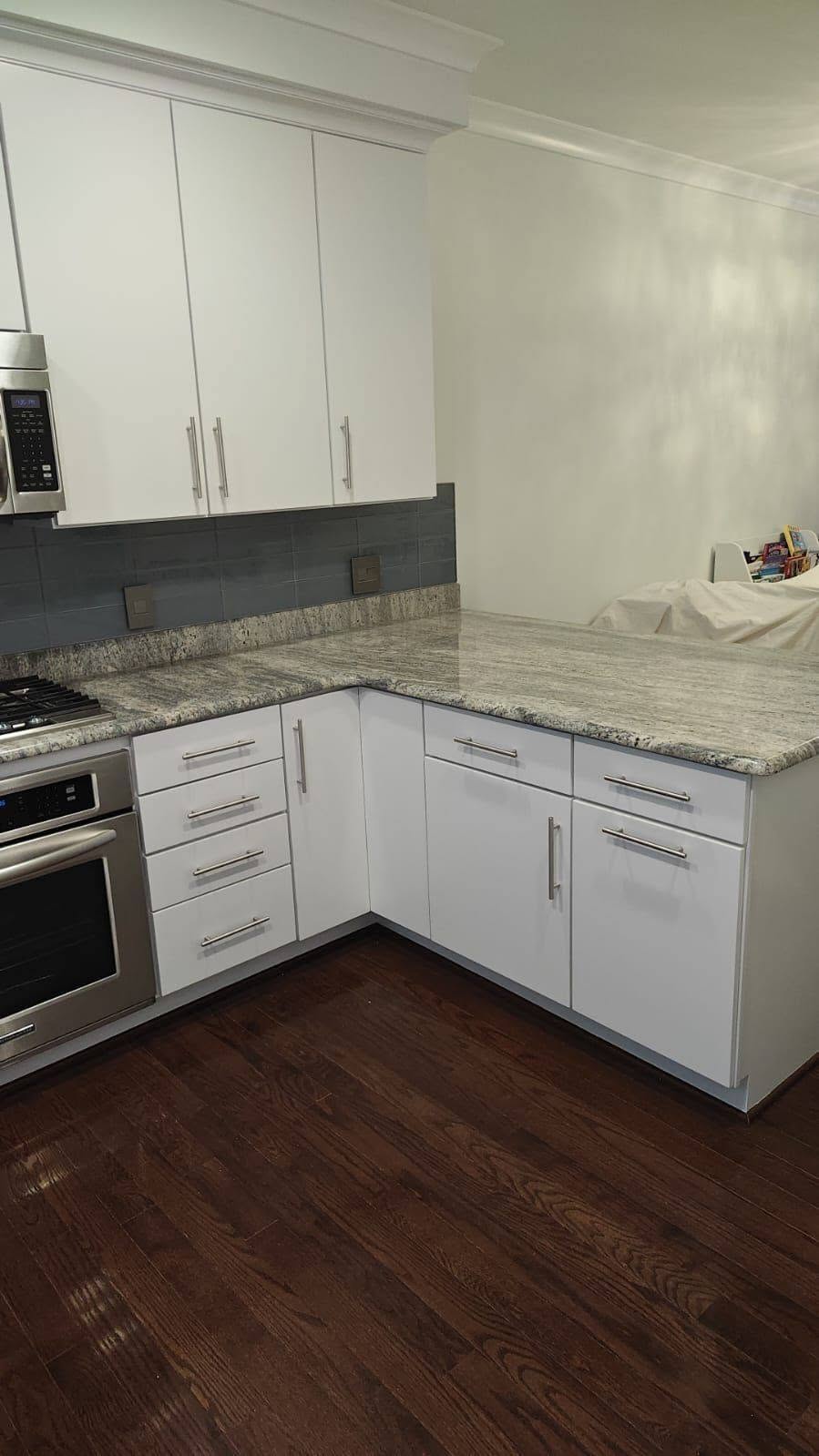 Grain-filled L-shaped kitchen — after