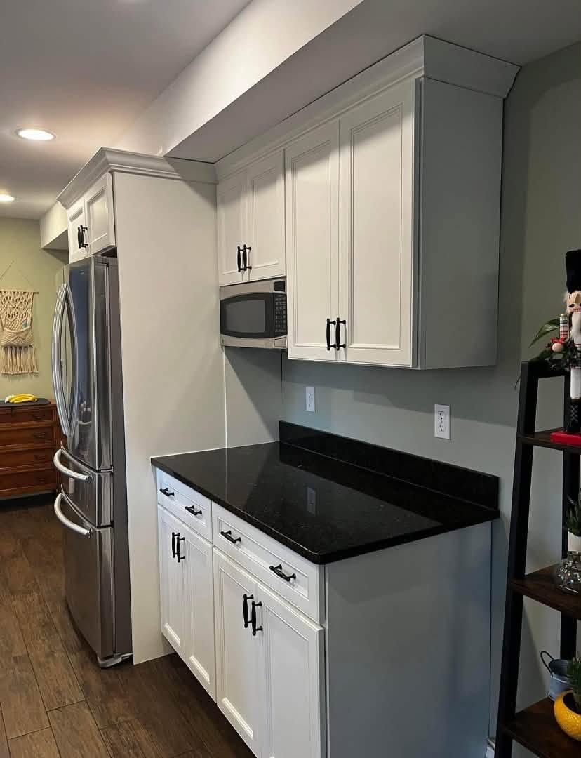 Durable neutral satin kitchen cabinet repaint in a Bethesda rental unit