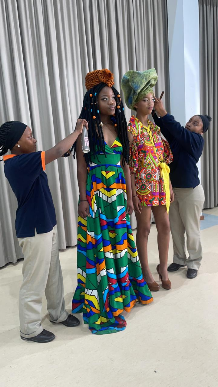 Students showcasing their creative avant-garde hairstyles on stage