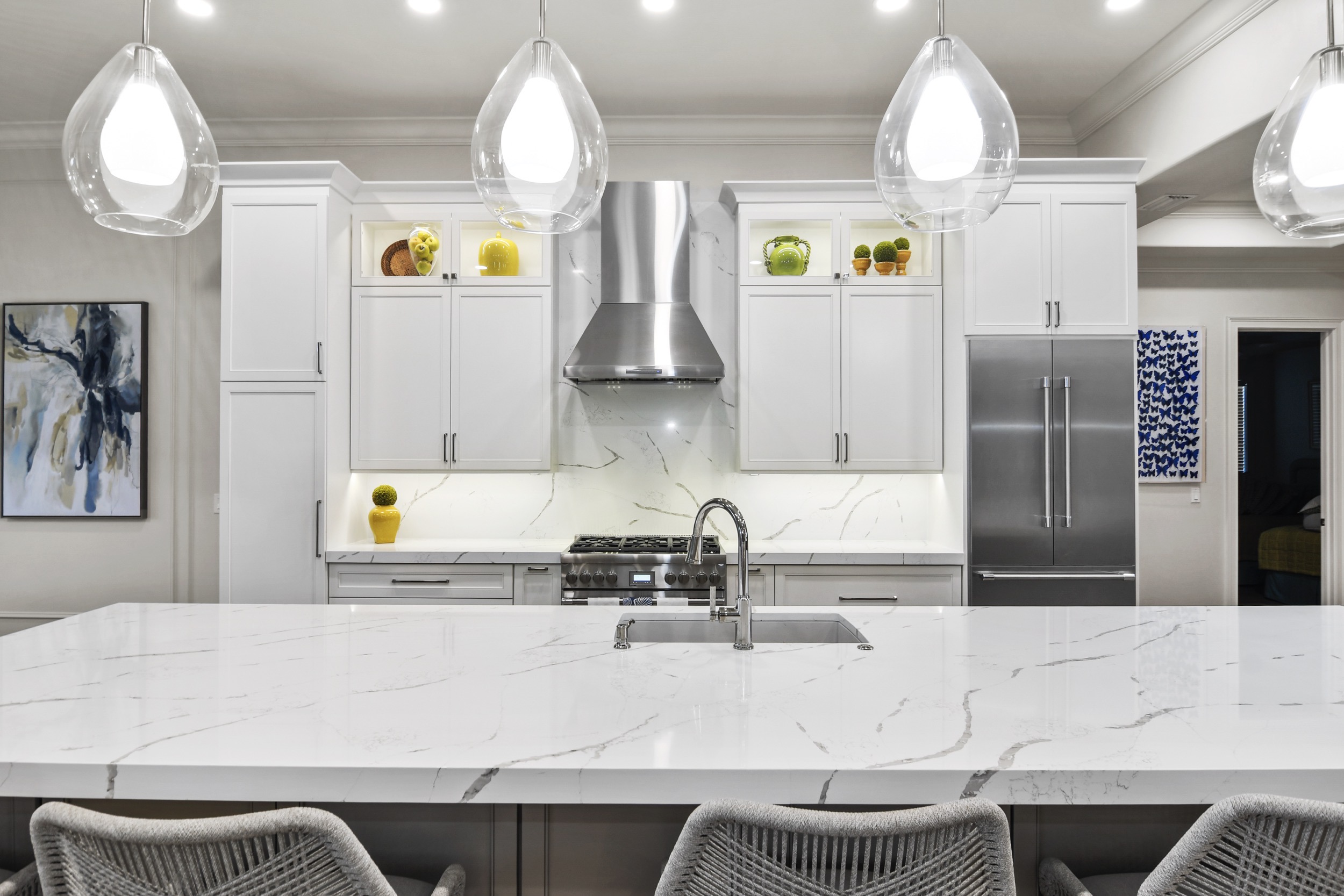 White Kitchen with Glass Pendant Lights