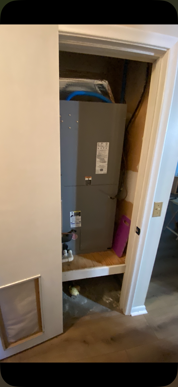 Old indoor air handler in a closet before a 3 ton heat pump replacement in Williston, FL