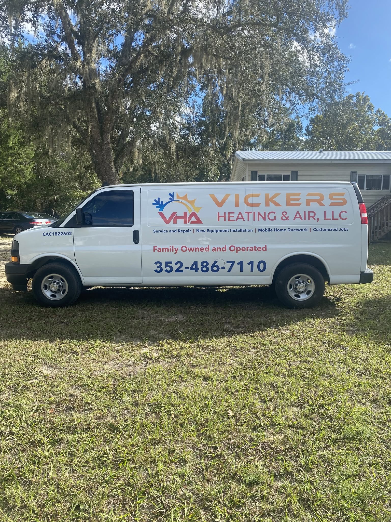 Vickers Heating & Air service van parked at a North Central Florida home, ready for an HVAC repair call