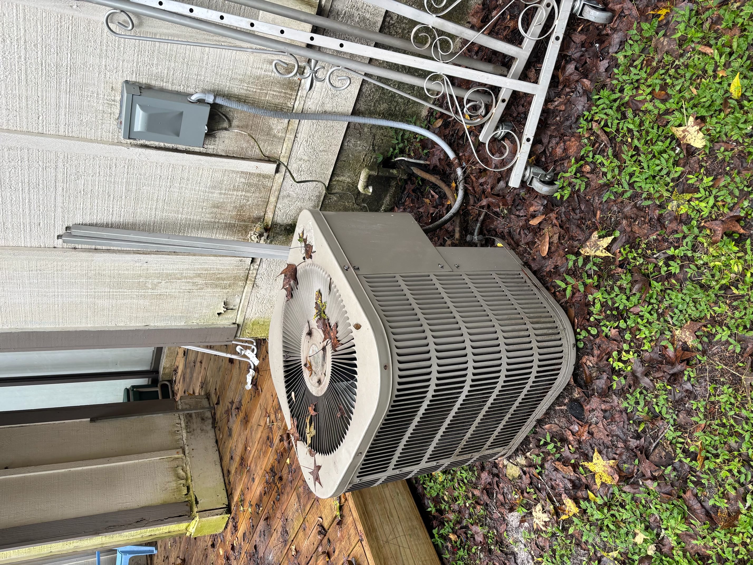 Old outdoor HVAC unit before heat pump replacement in Gainesville, FL