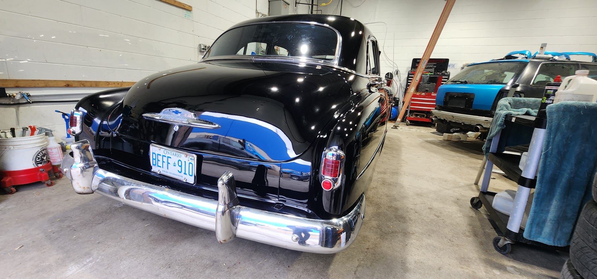 Classic car rear showing flawless paint finish and chrome detail after professional exterior detailing