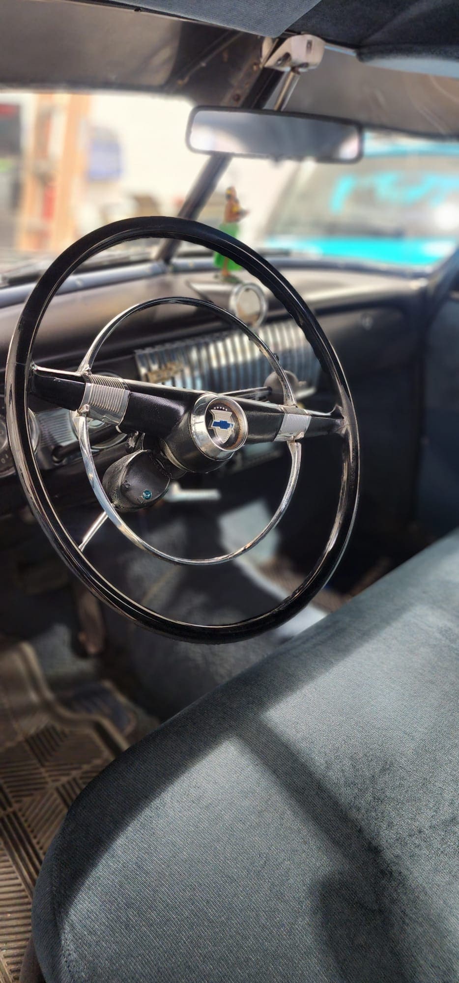 Restored vintage steering wheel showing meticulous interior detailing work