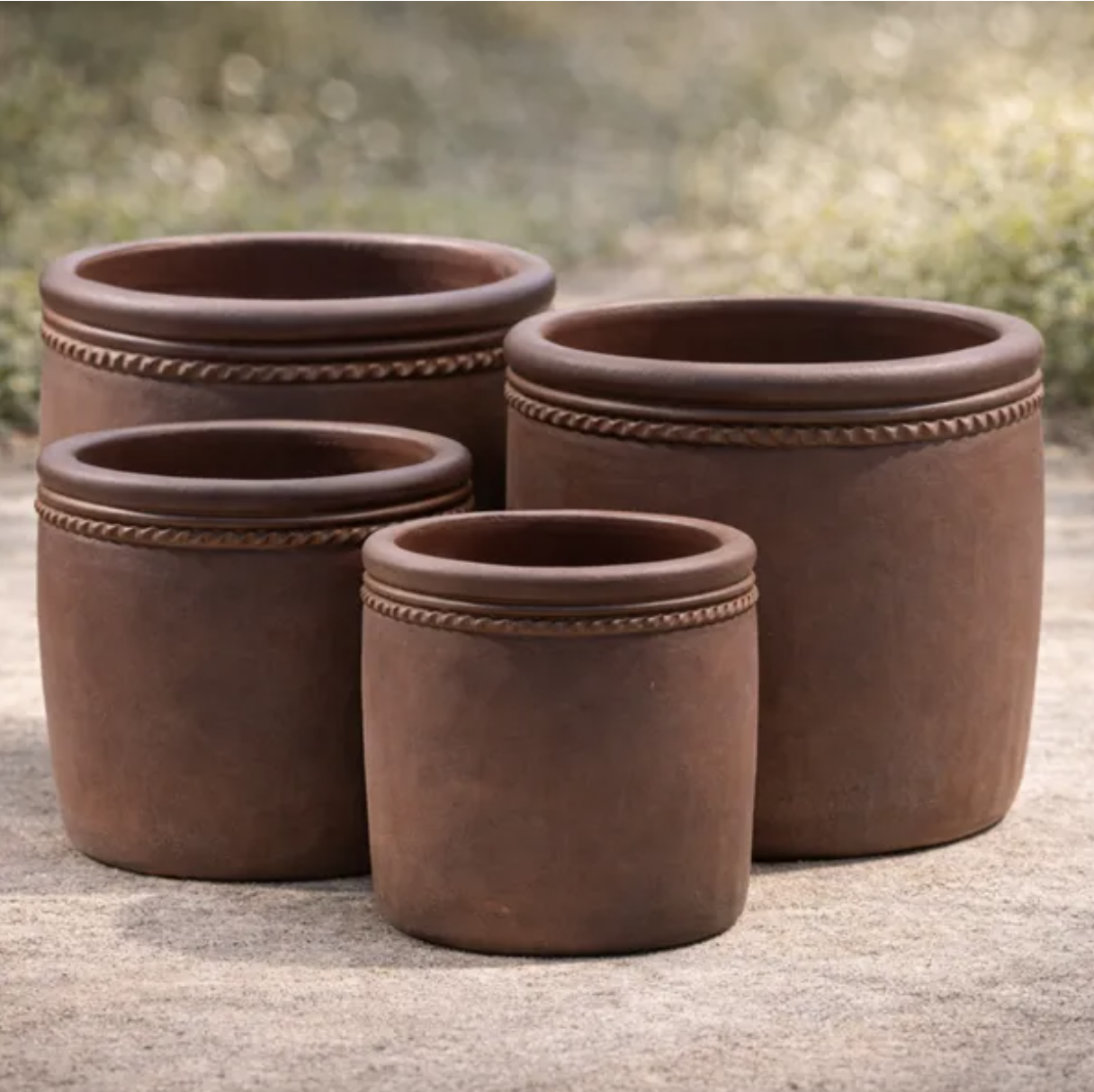 Dark black clay wholesale planters with handcrafted finishes and decorative rope trim in assorted sizes