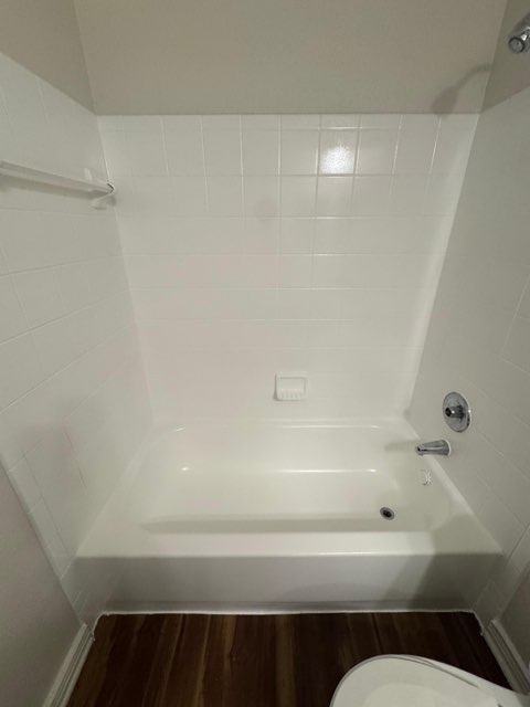 Bathroom after deep cleaning - sparkling clean bathtub with fresh tile work by Paint And Remodeling Aguilar LLC