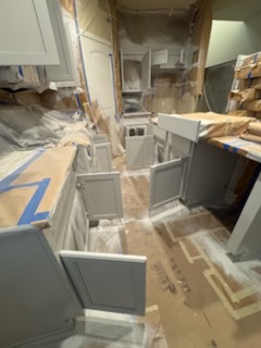 Kitchen under renovation with new cabinets being installed by Paint And Remodeling Aguilar