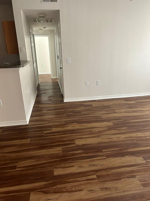 Newly installed luxury vinyl plank flooring with wood grain texture in Austin home