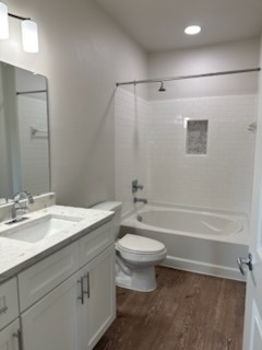 Bathroom before vanity remodel - white cabinets with light beige tile walls and basic white sink by Paint And Remodeling Aguilar LLC