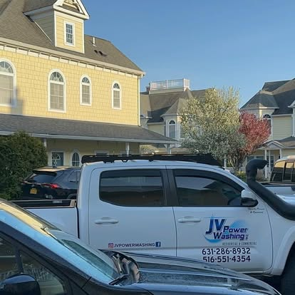 Commercial fleet and box trucks being pressure washed on Long Island