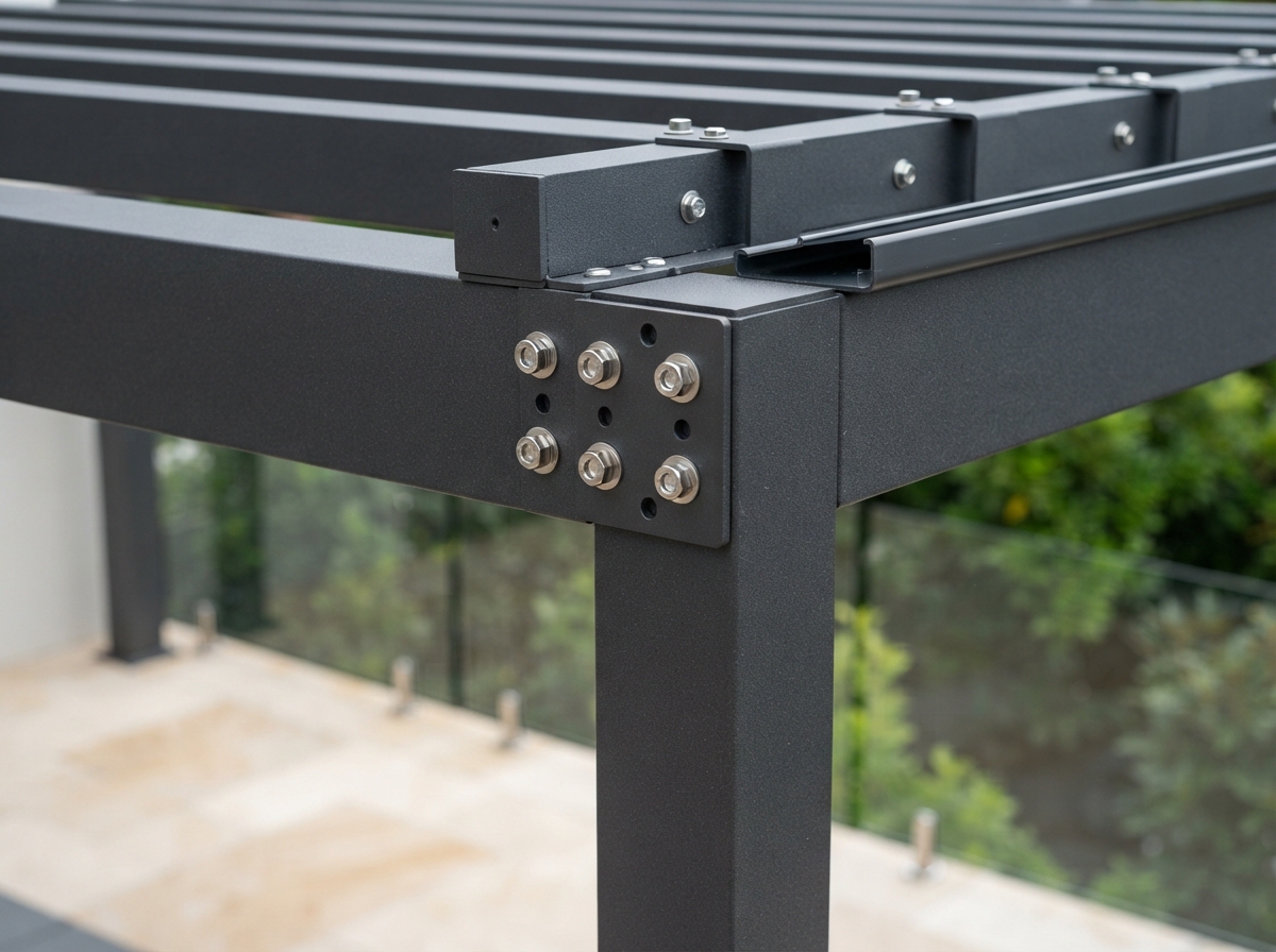 Detail shot of aluminum pergola structural connection with powder-coated beam and stainless steel hardware