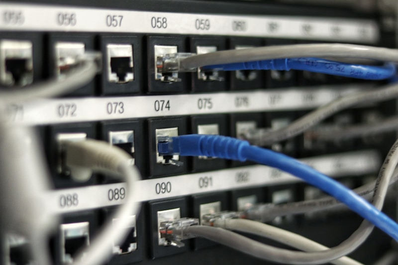 A Dedote systems engineer monitoring hosting infrastructure at a workstation