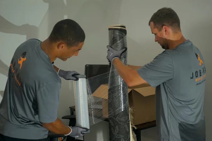 Job-Haul movers carefully wrapping and protecting furniture for a Vaughan move