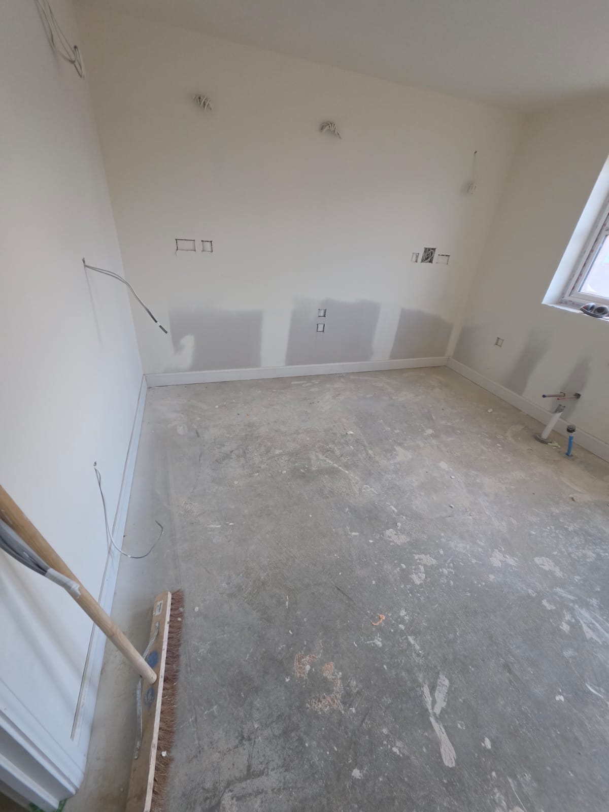 Plot room preparation with perimeter skirting boards, drylining and electrical first-fix in Harlow development by DWELLUX