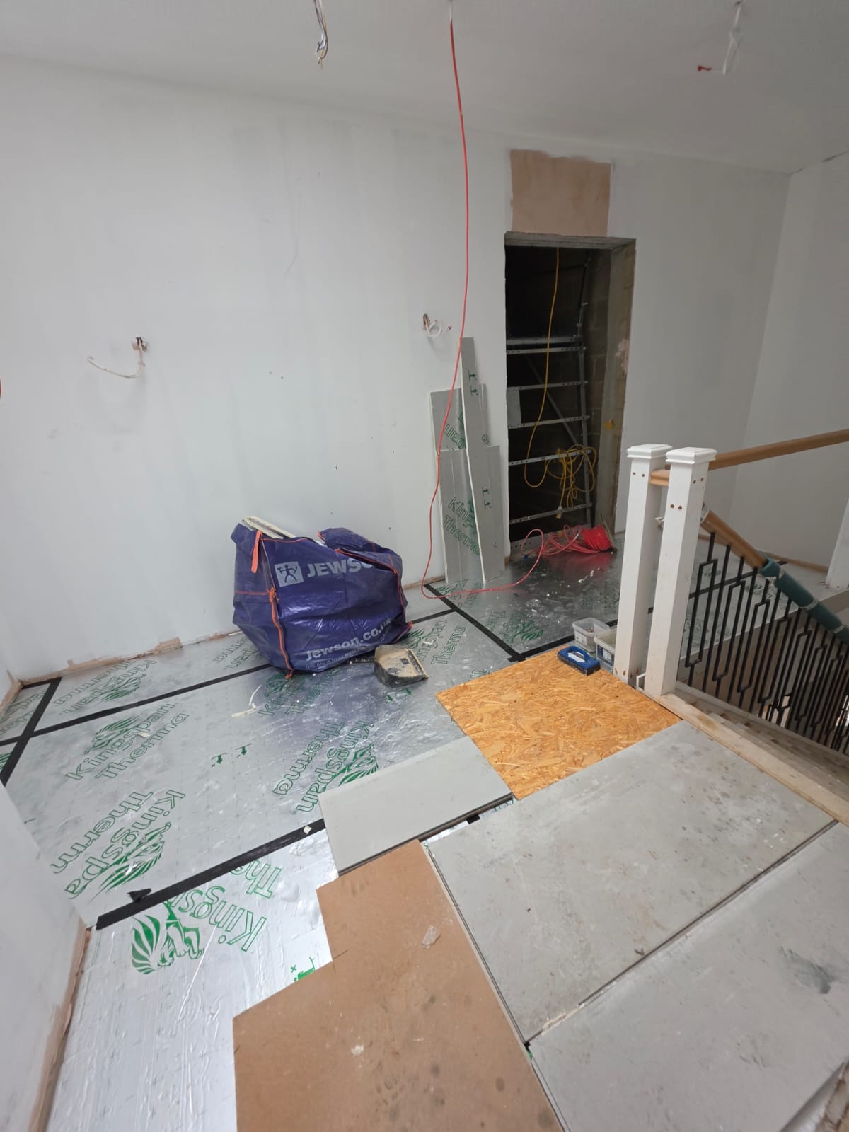 Kingspan Therma thermal floor insulation and cement board subfloor staging on landing in Southend-on-Sea by DWELLUX