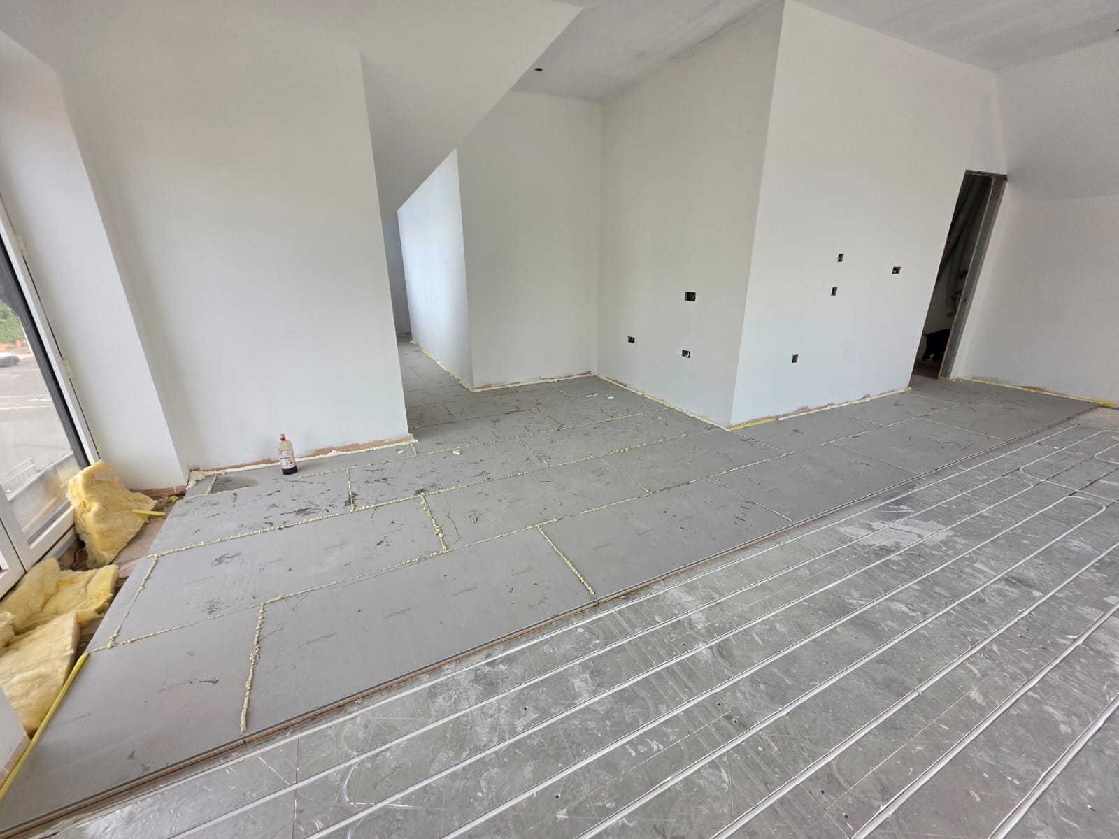 Subfloor preparation and underfloor heating insulation board fitting in Southend-on-Sea residential refurbishment by DWELLUX