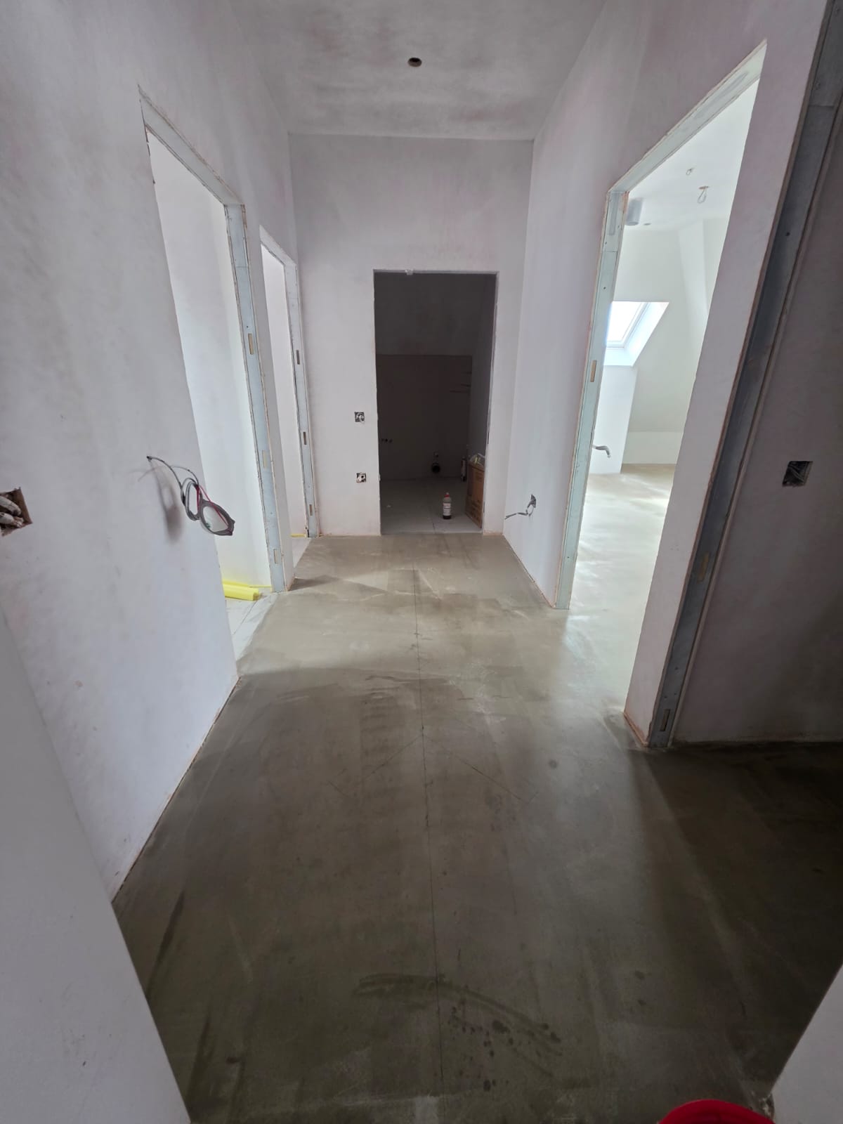 Hallway floor screeding and door lining installation in Southend-on-Sea property by DWELLUX