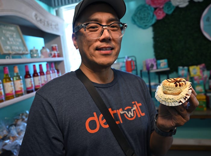 Seoung Lee reviewing bakery treats in Metro Detroit