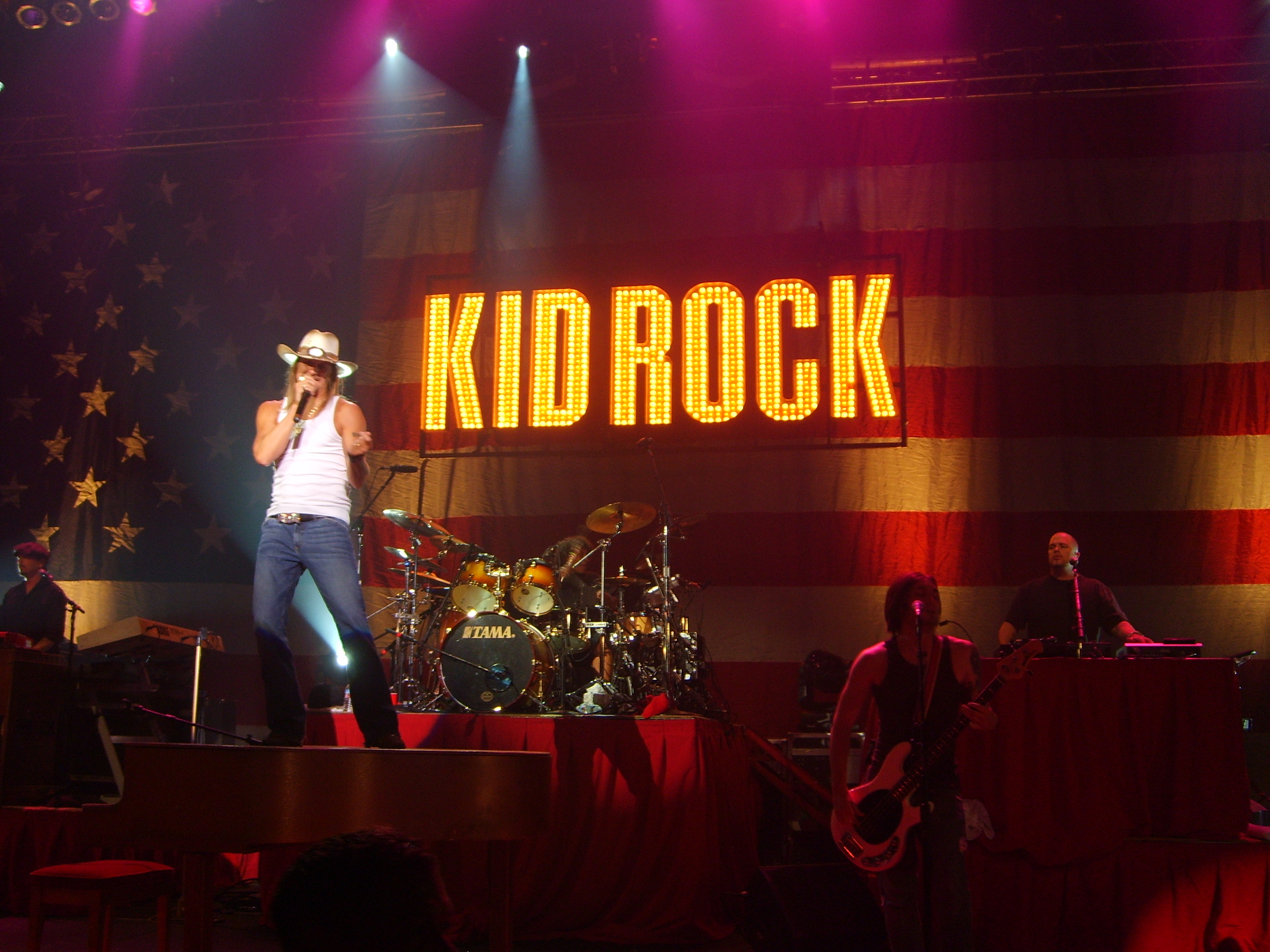 Kid Rock performing live in concert with pyrotechnics