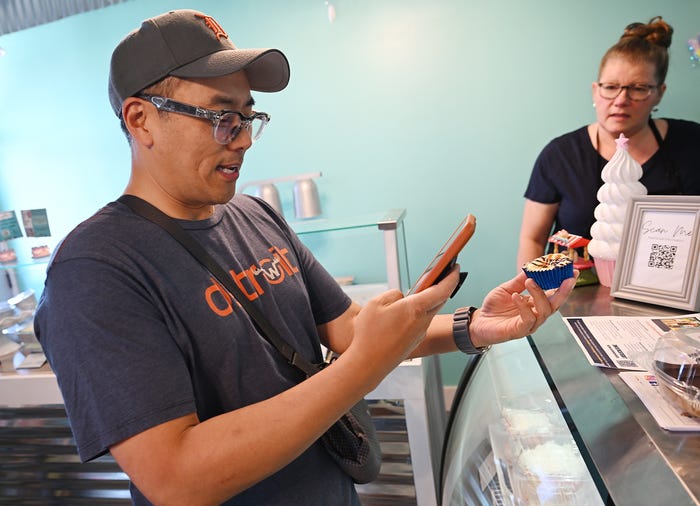 Seoung Lee photographing local food in Metro Detroit