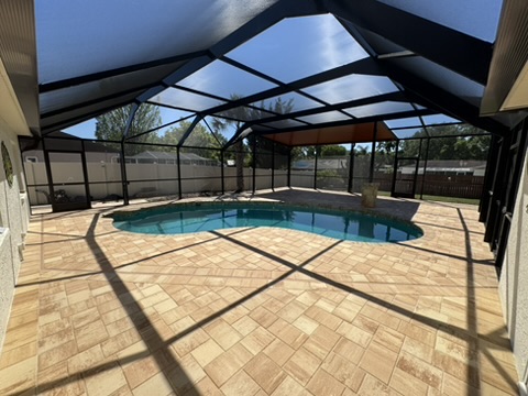 Screened Lagoon Pool Remodel with Paver Deck — Valrico, FL