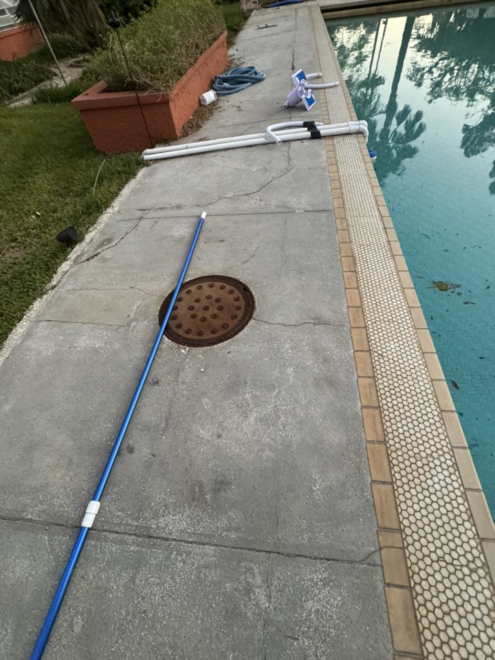 Before historic pool renovation in St. Petersburg — cracked deck and weathered coping
