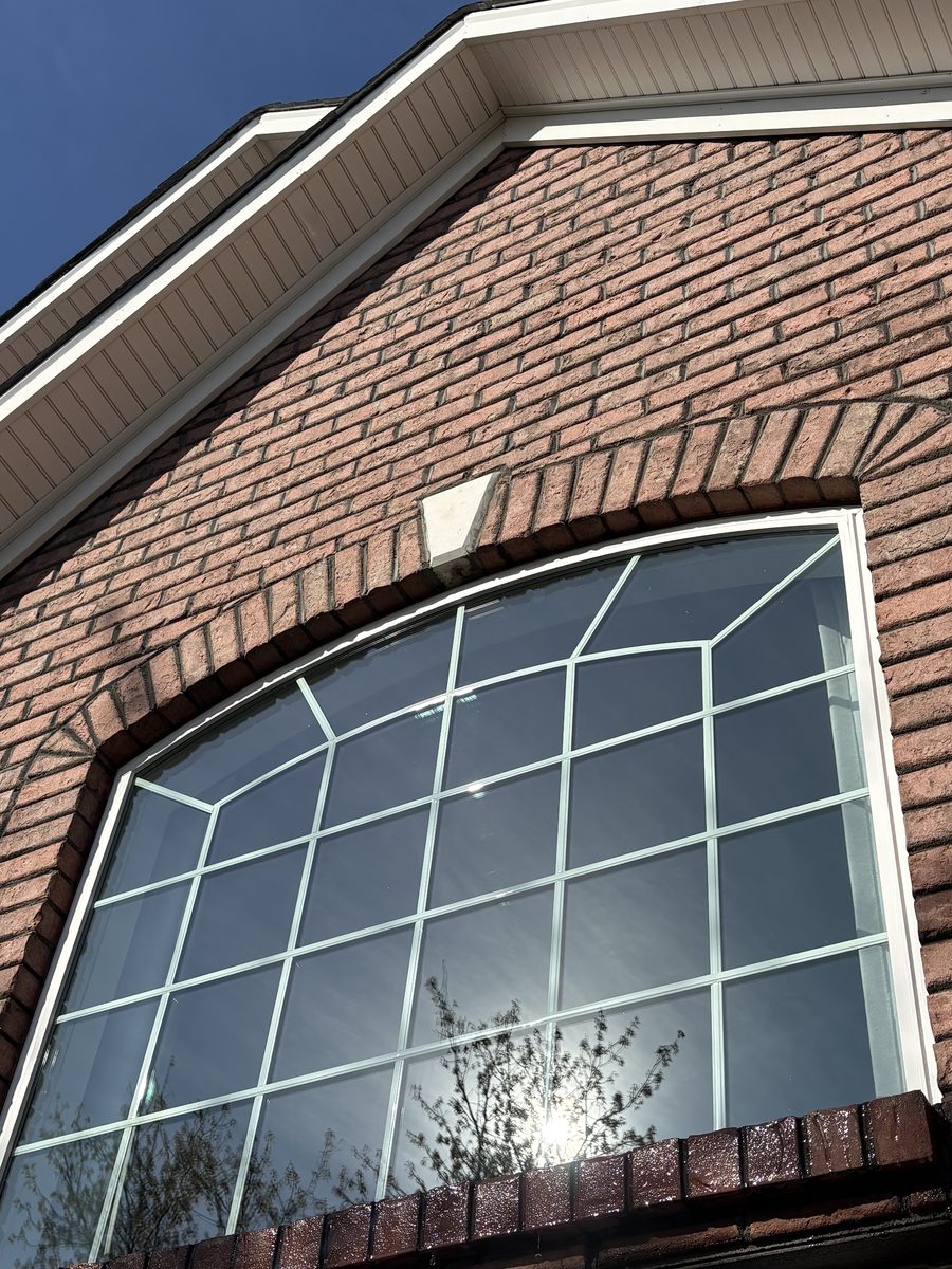The same arched window after cleaning