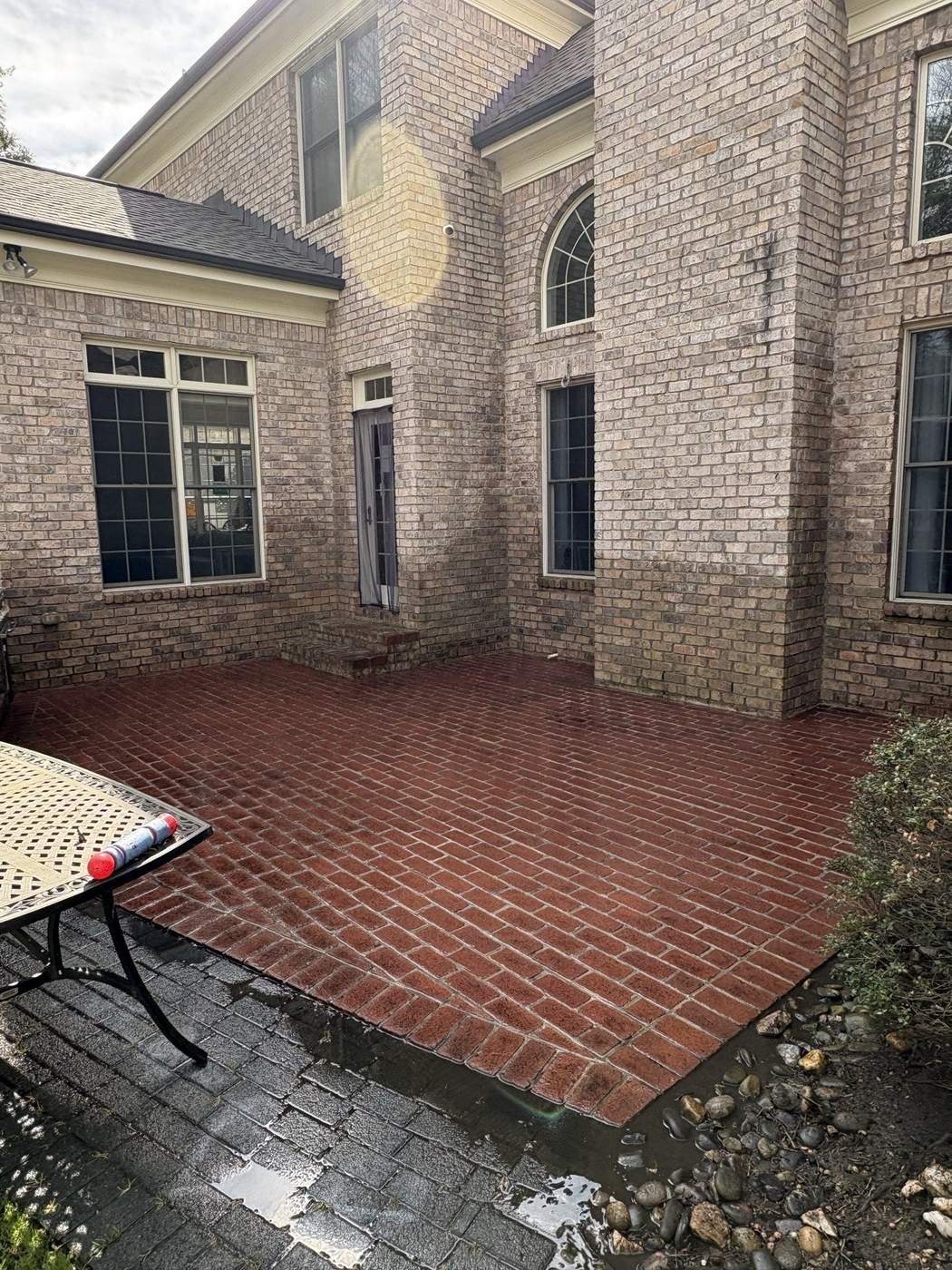 Brick patio clean and restored after pressure washing