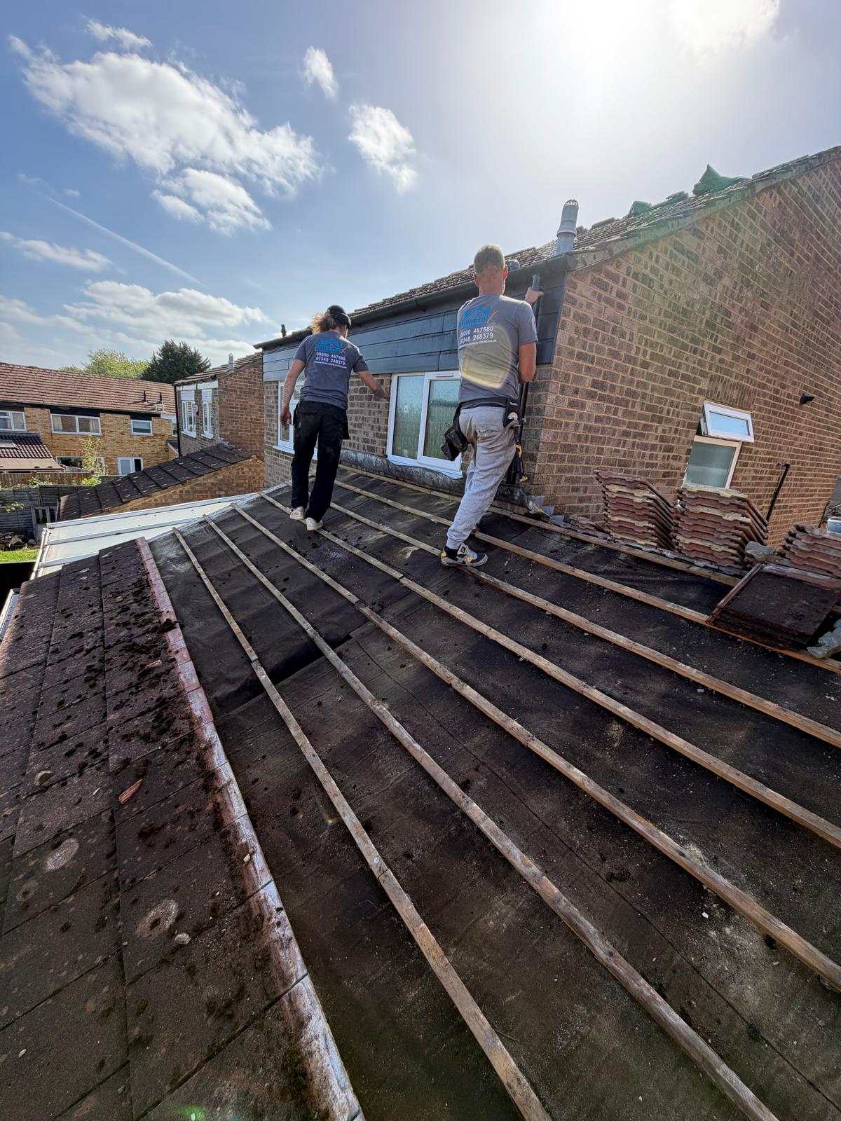 Primefix roofers carrying out roof repair and timber batten renewal on residential pitch roof