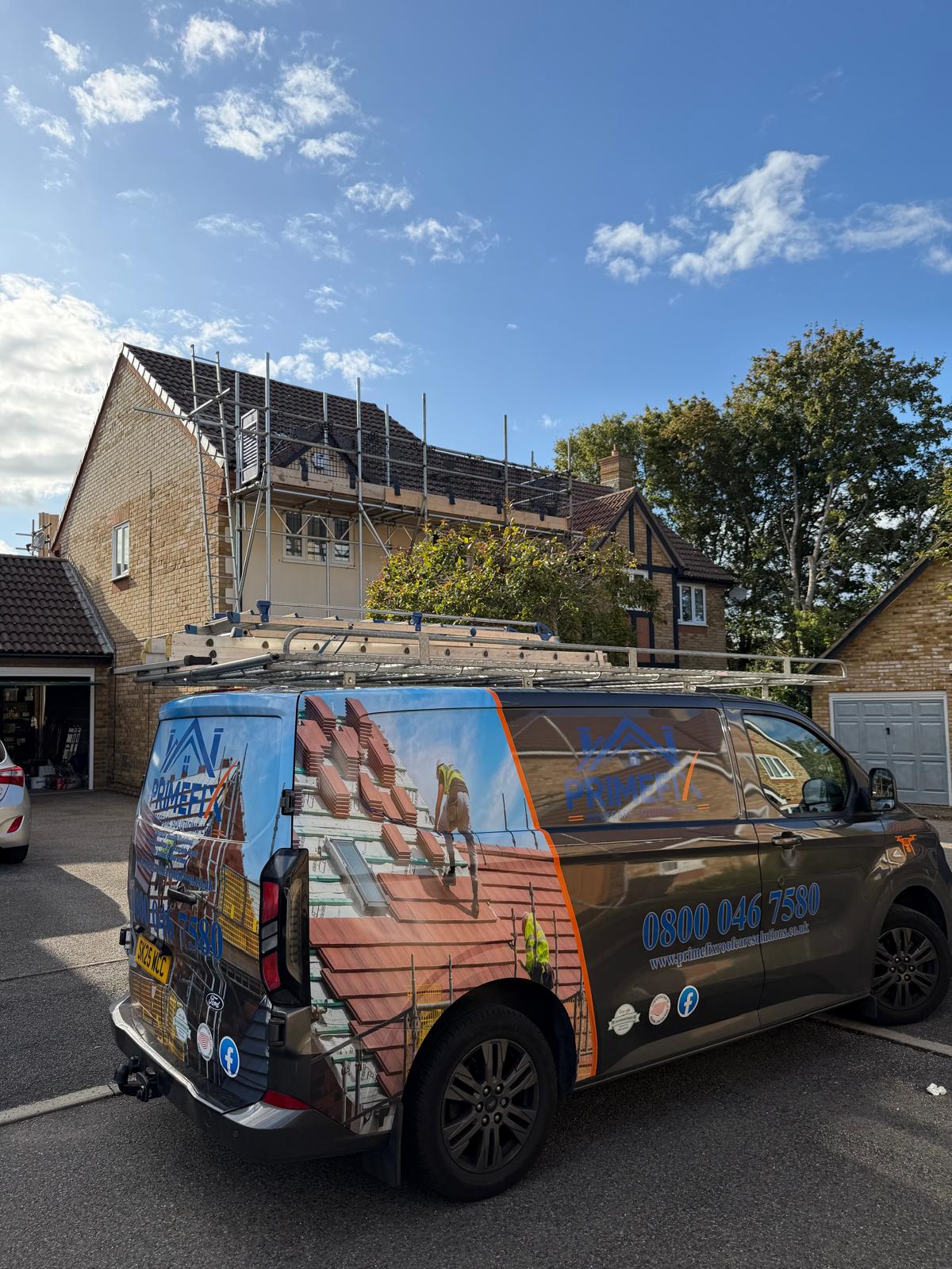 Primefix branded van on driveway with scaffolding in place for roof repair