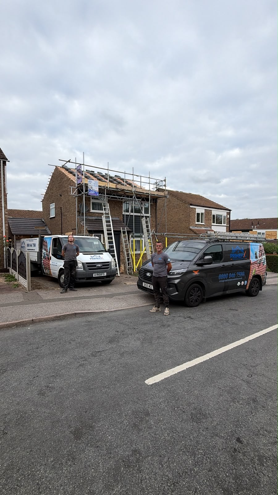 Primefix Roofcare team and vans on site with full scaffolding for complete re-roof