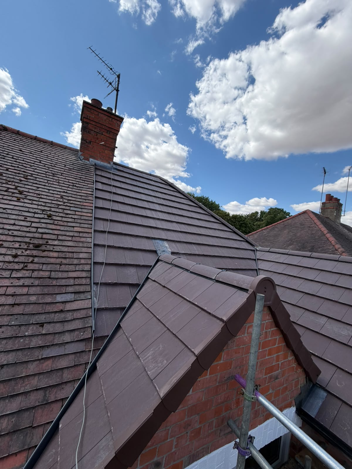 Pitched roof and dry verge gable system on residential brick extension