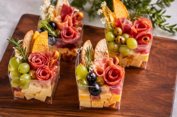 Custom charcuterie cups with cured meats, artisan cheeses and grapes