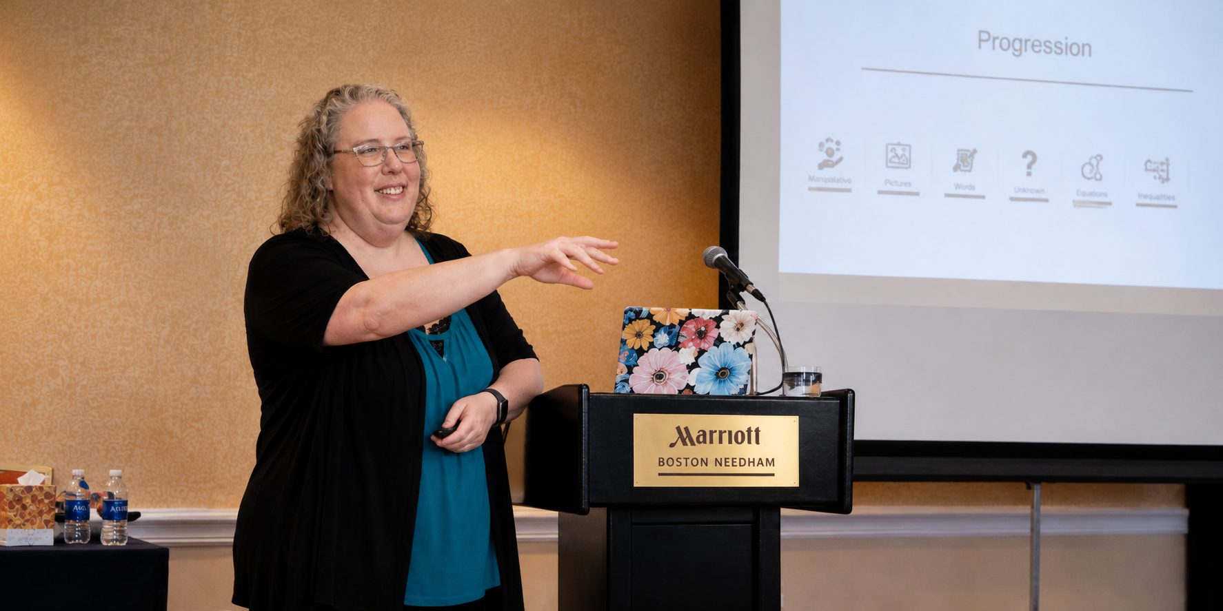 Dr. Michelle teaching and speaking with an audience