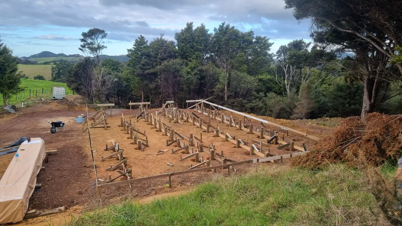 Residential Extension & Subfloor Framing Build - Foundation piles positioned and braced across the site, levelled to follow the contour of the land.