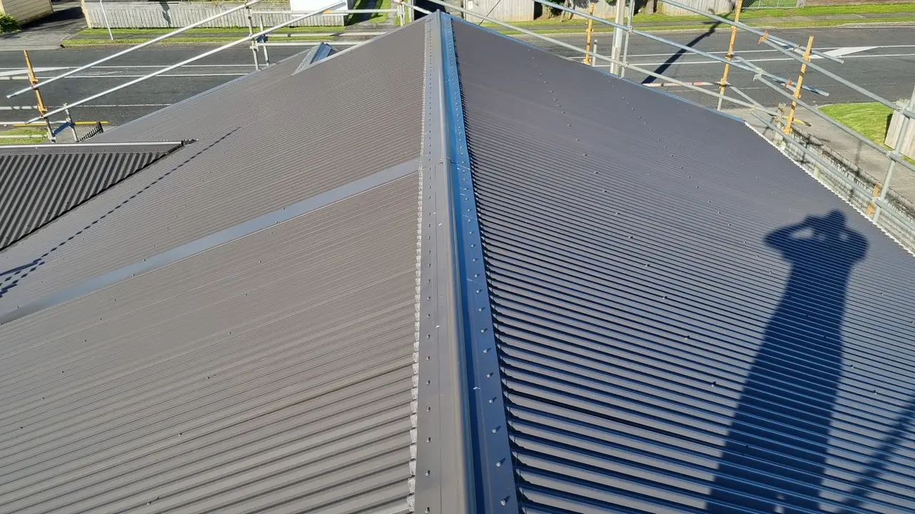 Roofing - Finished ridge and penetration flashing, dressed weathertight.
