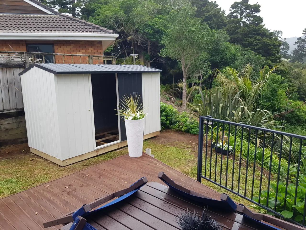 Garden Shed with Timber Decking - Timber deck and plant stand built alongside the shed, tying the outbuilding into the surrounding garden.
