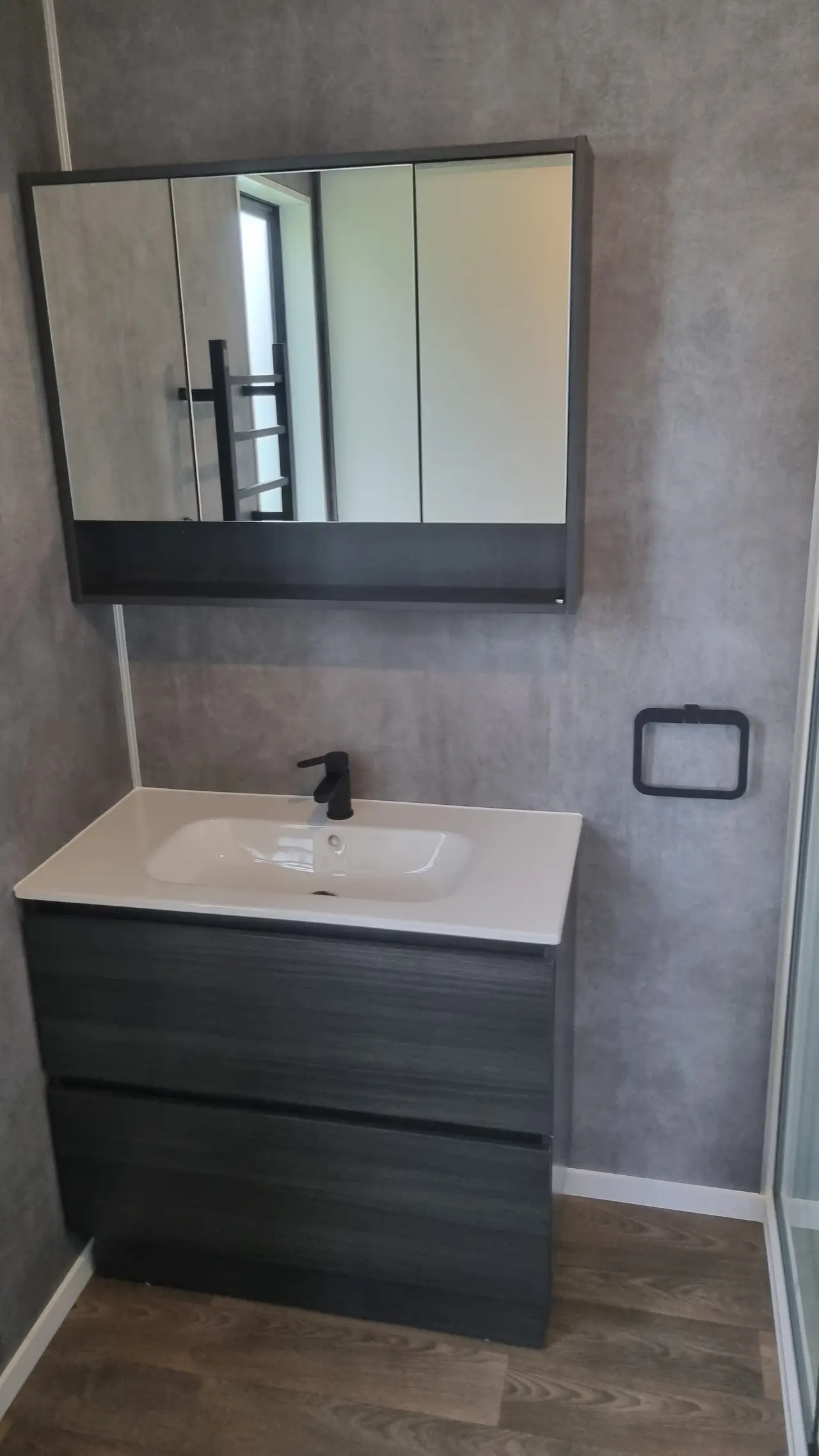 Modern Ensuite Renovation - Detailed view of the finished ensuite fixtures and dumawall tiles.