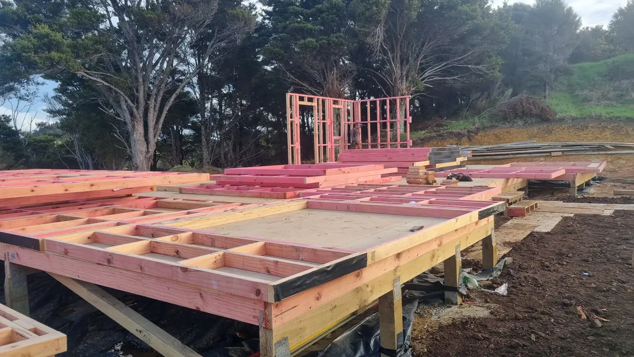 Residential Extension & Subfloor Framing Build - Subfloor platform laid and timber wall framing underway, with prefabricated frames standing on the new floor platform.