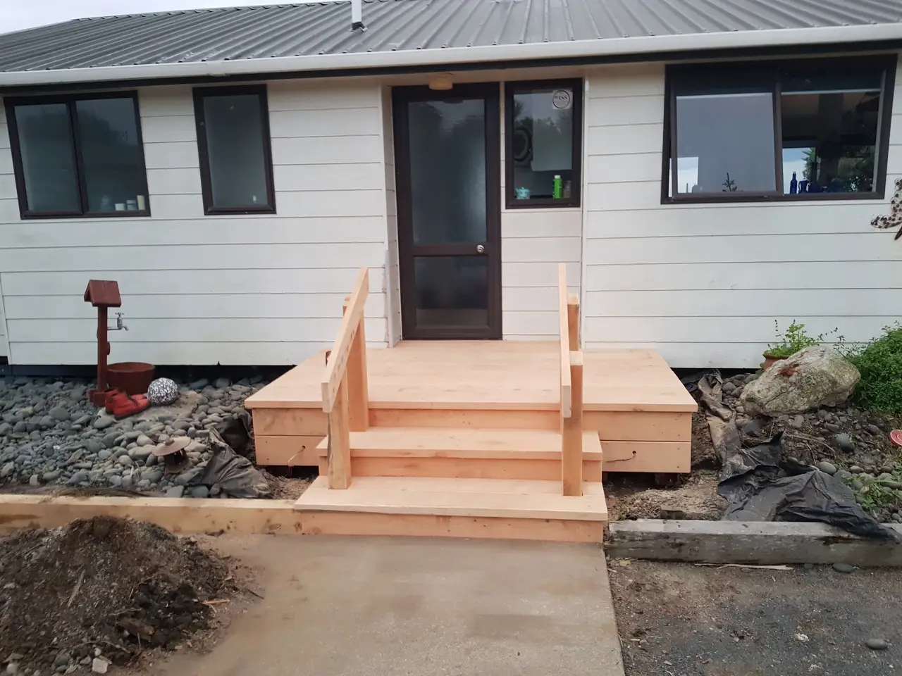 Small Timber Entry Deck with Steps - Front view of the 3 wide entrance steps and timber landing platform.