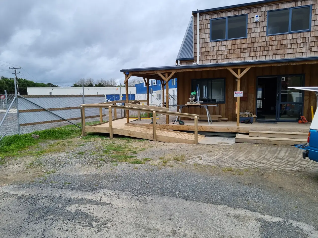 Timber Access Ramp - Completed timber access ramp connecting the entrance to ground level.