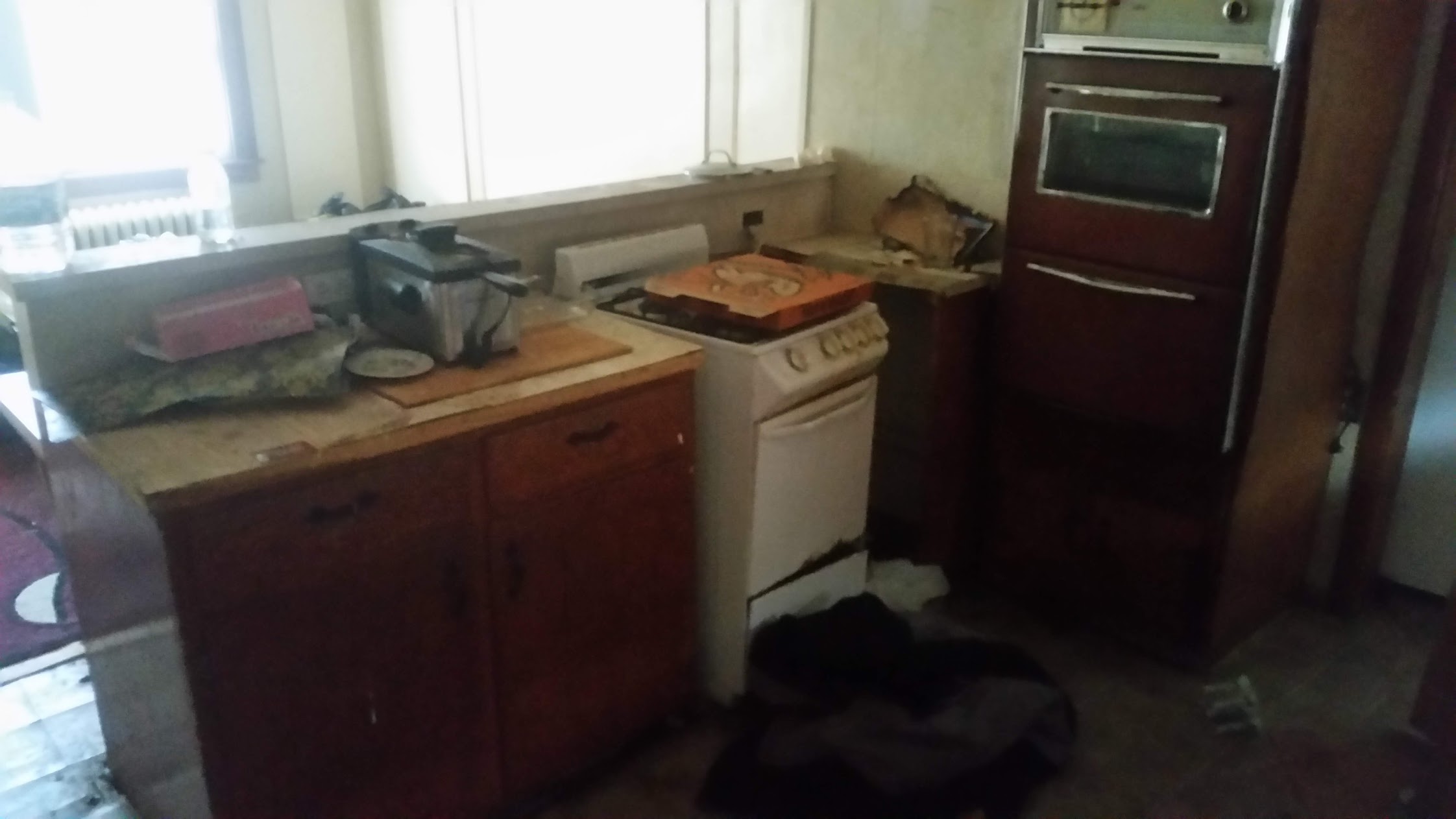 Kitchen — Worn Appliances & Clutter — before