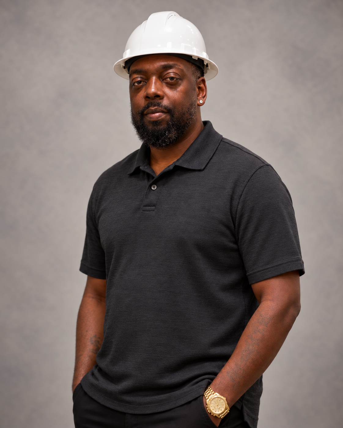 Chauncy Johnson, CEO of Louis Masonry LLC, wearing hard hat on jobsite
