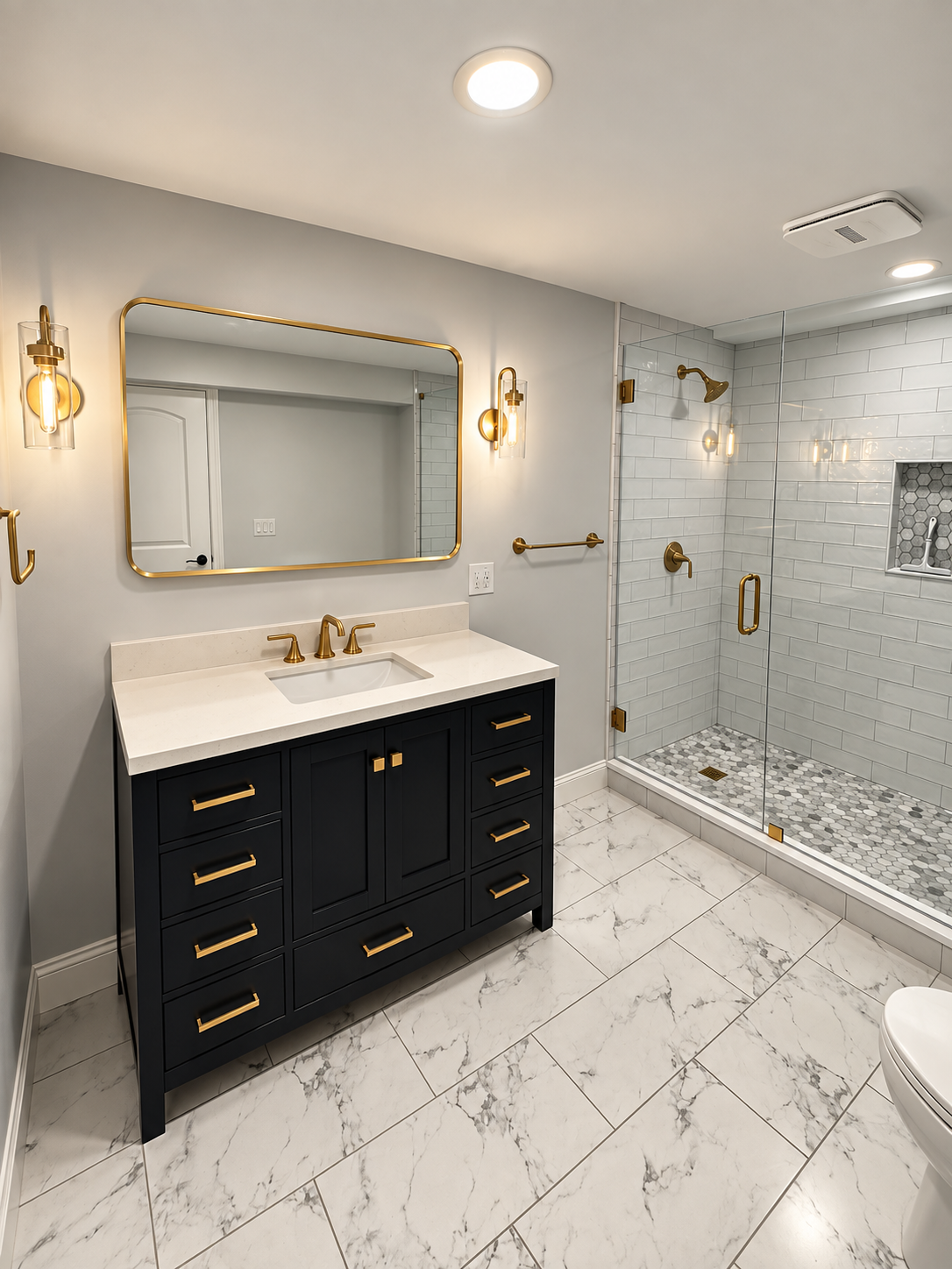 Primary bathroom remodel with navy vanity, brass hardware, and walk-in glass shower