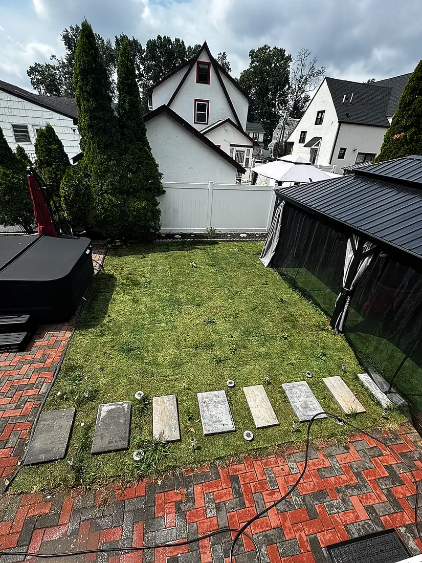 backyard lawn and pavers after restoration North NJ